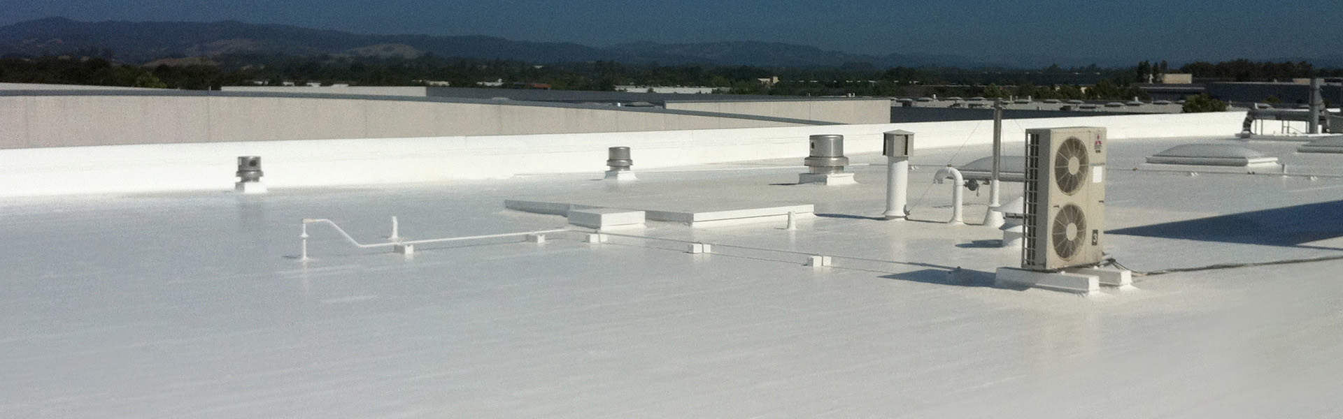 WE SPECIALIZE IN SPRAY FOAM ROOFING AND COOL ROOF COATINGS FOR COMMERCIAL AND INDUSTRIAL BUILDINGS